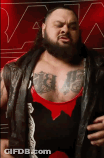 Man With Beard And Chest Tattoos Wearing Black Leather Vest GIF