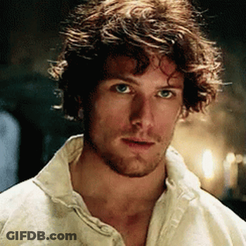 Man With Beard And Curly Hair In White Shirt GIF