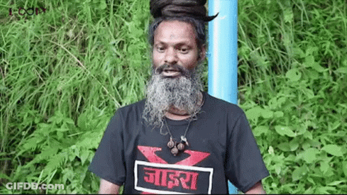 Man With Beard And Dreadlocks In Black T-Shirt And Blue Pole GIF
