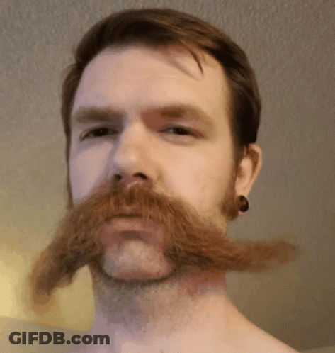 Man With Beard And Ear Plugs GIF