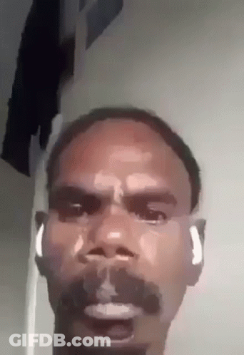 Man With Beard And Earbuds Making Funny Face GIF