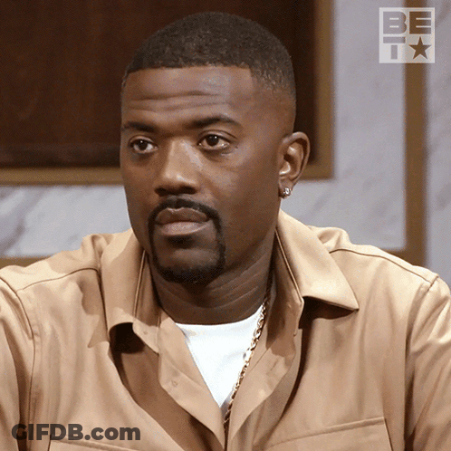 Man With Beard And Earrings In Tan BET Shirt GIF