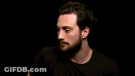 Man With Beard And Earrings Wearing Black Shirt GIF