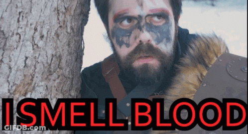 Man With Beard And Face Paint Next To Tree Saying I Smell Blood GIF
