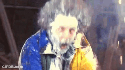 Man With Beard And Frozen Hair In Blue And Yellow Jacket GIF
