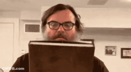 Man With Beard And Glasses Holding Book GIF