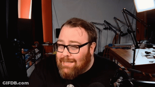 Man With Beard And Glasses In Black Shirt GIF