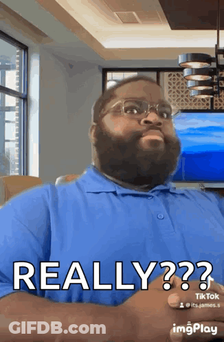 Man With Beard And Glasses In Blue Shirt Saying Really GIF