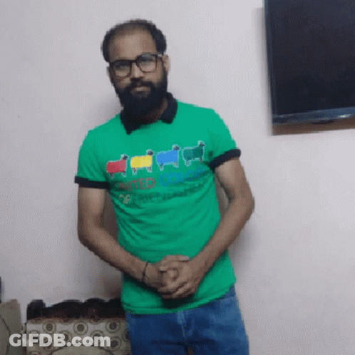 Man With Beard And Glasses In Green Shirt Saying United Colors Of Benetton GIF