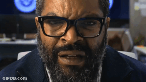Man With Beard And Glasses Looking At Camera GIF