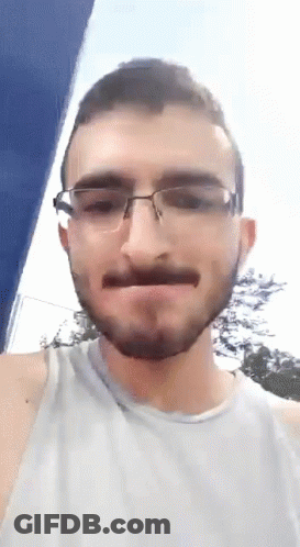 Man With Beard And Glasses Making Funny Face GIF