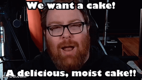 Man With Beard And Glasses Says We Want A Cake A Delicious Moist Cake GIF