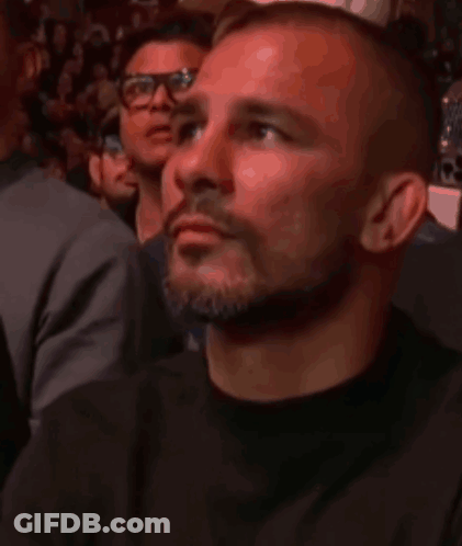 Man With Beard And Glasses Watching Fight GIF