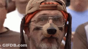 Man With Beard And Glasses Wearing Dog Mask And Baseball Cap GIF