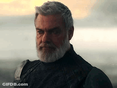 Man With Beard And Gray Hair Standing By Water GIF