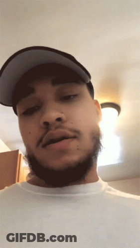 Man With Beard And Hat Looking At Camera GIF