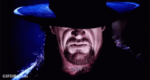 Man With Beard And Hat Looking At Camera GIF