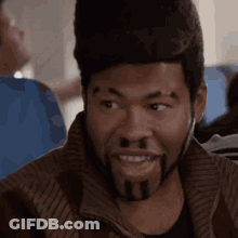 Man With Beard And Hat Sitting On Plane GIF