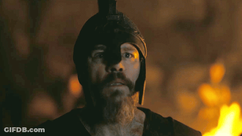 Man With Beard And Helmet Before Burning Fire GIF