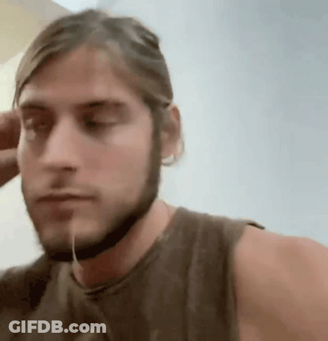 Man With Beard And Helmet Looking At Camera GIF