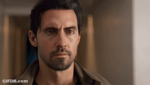 Man With Beard And Long Hair Looking At Camera GIF