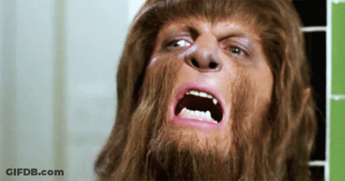 Man With Beard And Long Hair Making Funny Face GIF