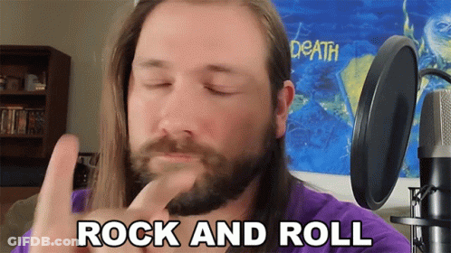 Man With Beard And Long Hair Says Rock And Roll GIF