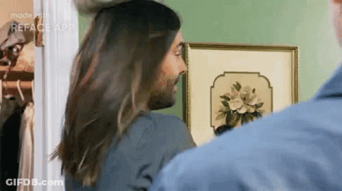 Man With Beard And Long Hair Standing Next To Woman With Long Hair GIF
