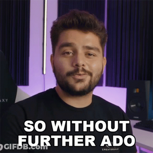 Man With Beard And Mustache In Black Shirt Saying Without Further Ado GIF