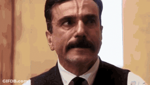 Man With Beard And Mustache In Vest And Tie GIF