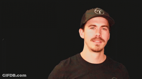 Man With Beard And Mustache Looking At Camera GIF