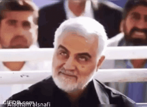 Man With Beard And Mustache Smiling In Crowd GIF