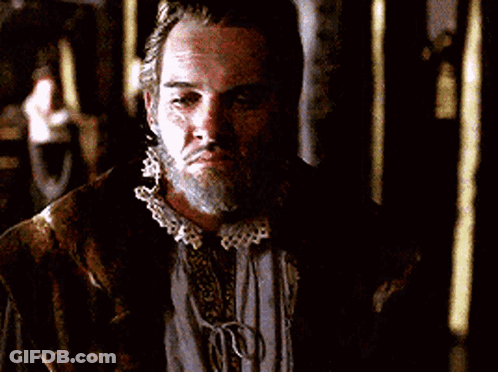 Man With Beard And Ruffled Collar Looking Down GIF