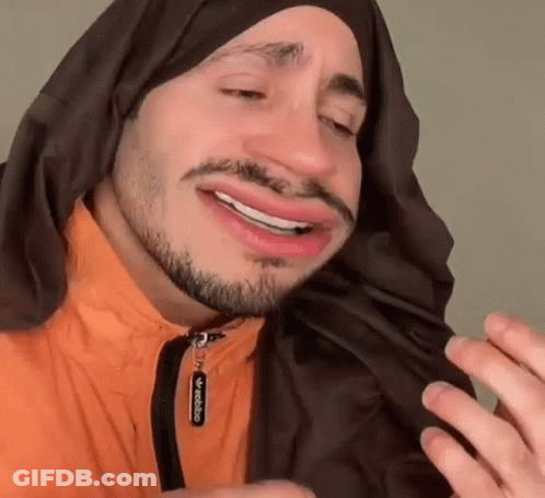 Man With Beard And Scarf Making Face GIF