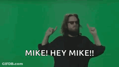 Man With Beard And Sunglasses Waving Saying Mike Hey Mike GIF