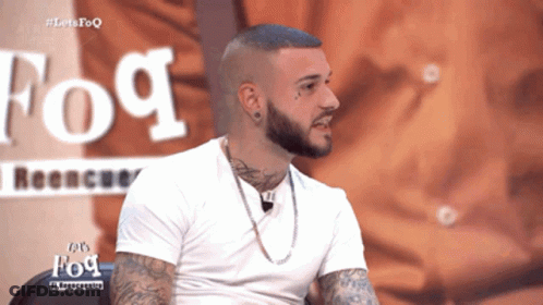 Man With Beard And Tattoos By Fog Sign GIF