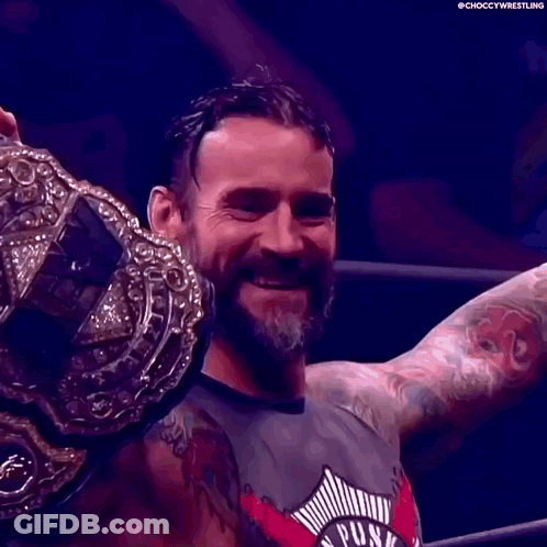 Man With Beard And Tattoos Holding Wrestling Championship Belt GIF