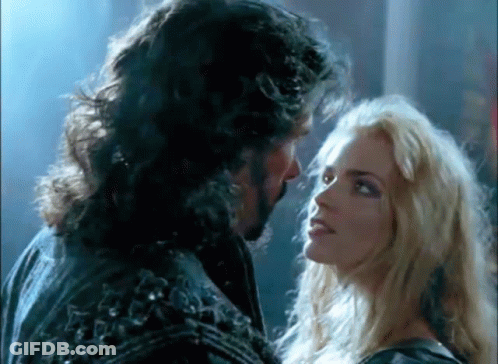 Man With Beard And Woman Blonde Hair Looking At Each Other GIF