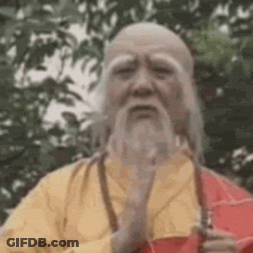 Man With Beard And Yellow Robe Holding Sword GIF