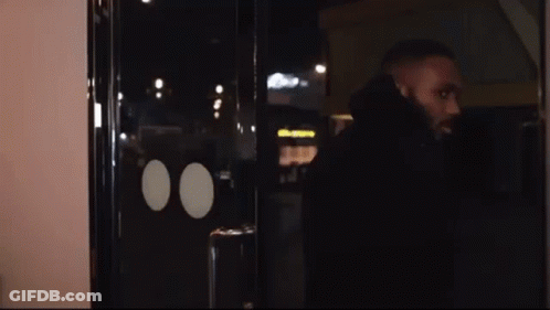 Man With Beard At Glass Door GIF