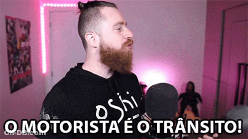 Man With Beard At Microphone Saying O Motorista GIF