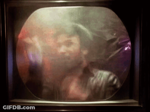 Man With Beard Behind Smokey Screen GIF