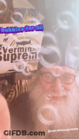 Man With Beard Blowing Bubbles Vermin Supreme GIF