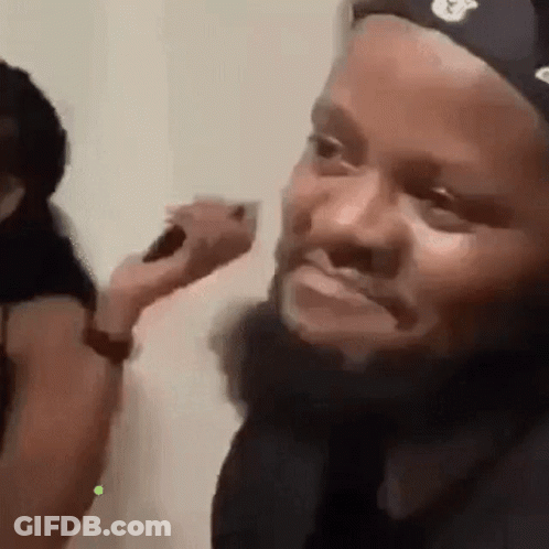 Man With Beard Brushed By Woman GIF