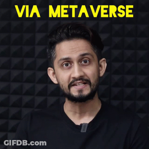 Man With Beard Clapping In Front Of Via Metaverse Wall GIF