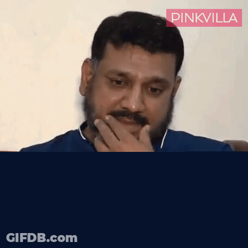 Man With Beard Covering Mouth GIF