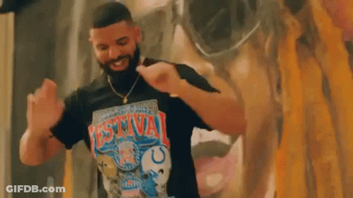 Man With Beard Dancing In Front Of Mural GIF
