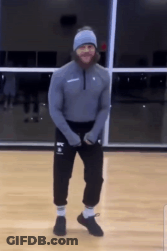 Man With Beard Dancing In Gym Wearing UFC Sweatshirt GIF