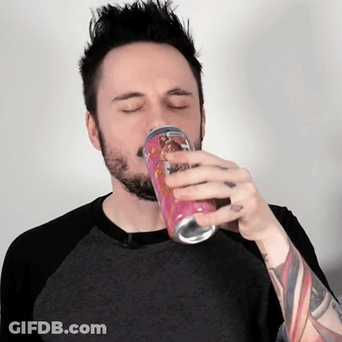 Man With Beard Drinking From Pink Can GIF