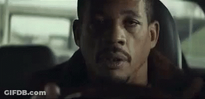 Man With Beard Driving Car Looking At Camera GIF